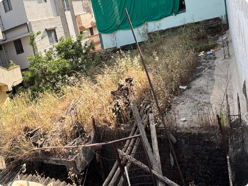 Neglected-Old-Terrace-with-Overgrown-Weeds-and-Damp-Walls